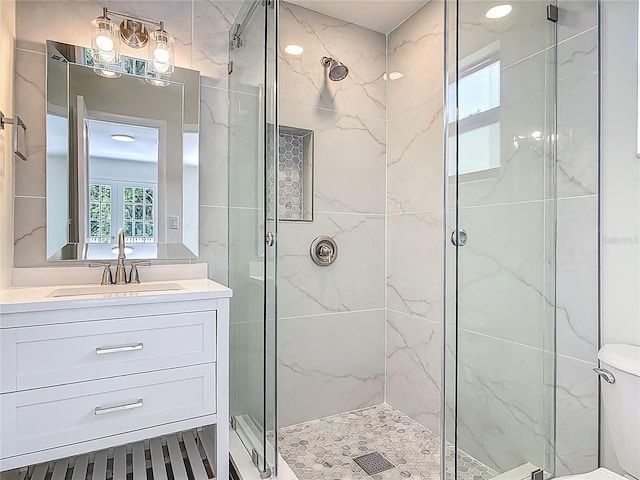 34 Aaron Cir, Ormond Beach, FL 32174 - full bath with a marble finish shower, vanity, and toilet