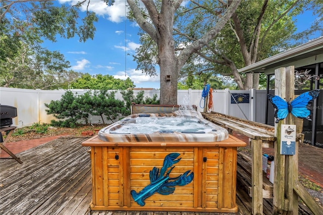 9611 107th Ave N, Largo, FL 33773 - wooden deck with a hot tub and a fenced backyard