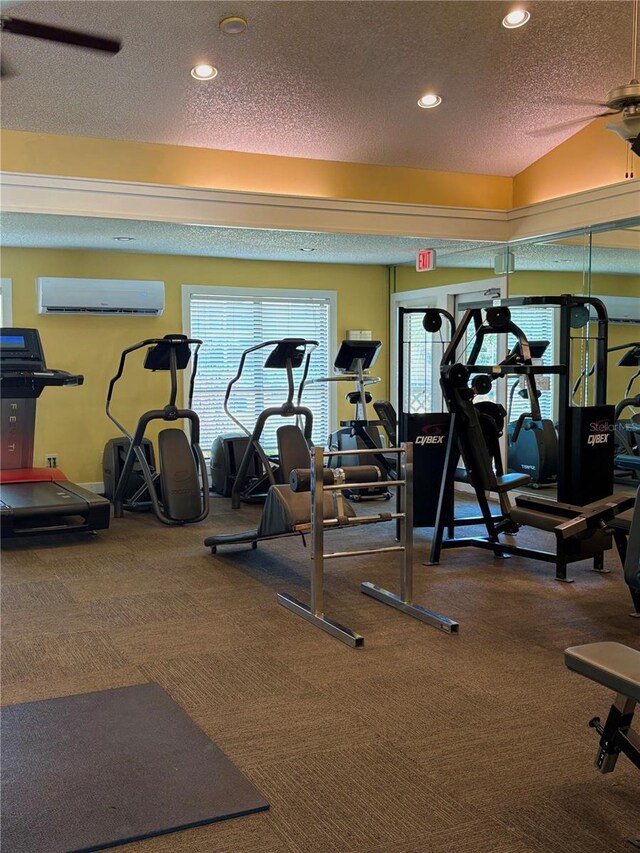 11901 4th St N Unit 5111, Saint Petersburg, FL 33716 - gym with a textured ceiling, recessed lighting, carpet flooring, and a wall mounted air conditioner