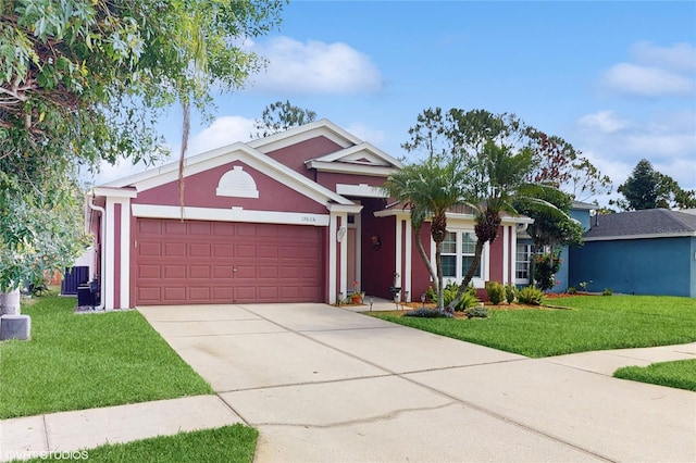 19635 Bellehurst Loop, Land O Lakes, FL 34638 - ranch-style house featuring an attached garage, stucco siding, a front lawn, and driveway