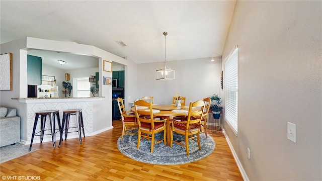 19635 Bellehurst Loop, Land O Lakes, FL 34638 - dining area with light wood-style floors and baseboards