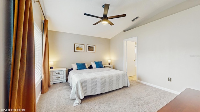 19635 Bellehurst Loop, Land O Lakes, FL 34638 - bedroom with light carpet, lofted ceiling, multiple windows, baseboards, and a ceiling fan