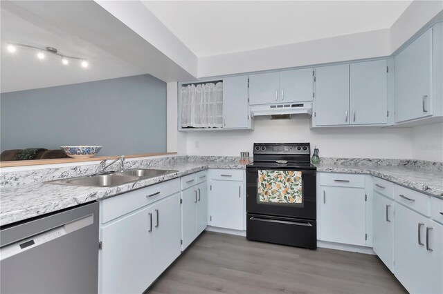 6817 Stones Throw Cir N Unit 17203, Saint Petersburg, FL 33710 - kitchen with black electric range, dishwasher, under cabinet range hood, a sink, and wood finished floors