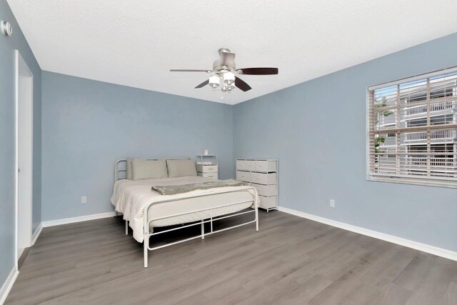 6817 Stones Throw Cir N Unit 17203, Saint Petersburg, FL 33710 - bedroom with wood finished floors, baseboards, and ceiling fan
