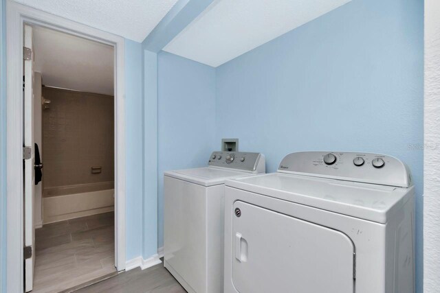 6817 Stones Throw Cir N Unit 17203, Saint Petersburg, FL 33710 - laundry room featuring washing machine and clothes dryer