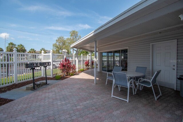 6817 Stones Throw Cir N Unit 17203, Saint Petersburg, FL 33710 - view of patio / terrace featuring outdoor dining area