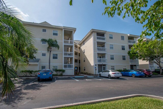 6817 Stones Throw Cir N Unit 17203, Saint Petersburg, FL 33710 - view of apartment building / complex with uncovered parking