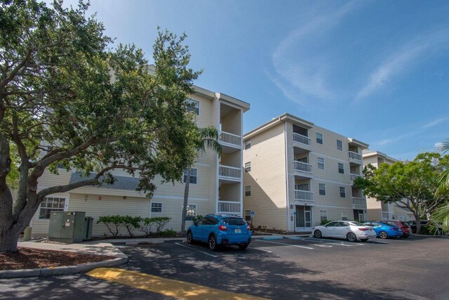 6817 Stones Throw Cir N Unit 17203, Saint Petersburg, FL 33710 - view of apartment building / complex featuring uncovered parking