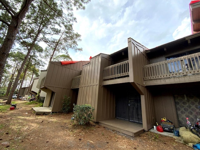 5310 Pebble Beach Dr Unit F, Orlando, FL 32811 - rear view of property featuring a balcony