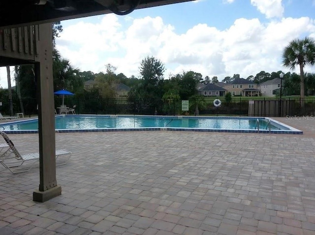 5310 Pebble Beach Dr Unit F, Orlando, FL 32811 - community pool featuring a patio area