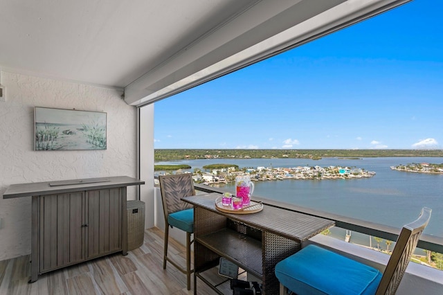 17920 Gulf Blvd Unit 1901, Redington Shores, FL 33708 - balcony featuring a water view and outdoor dining space
