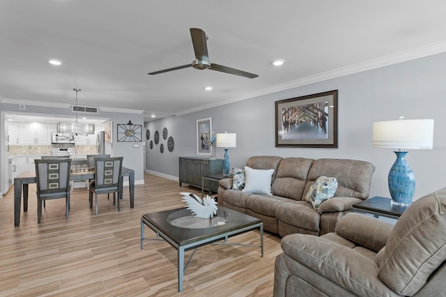 17920 Gulf Blvd Unit 1901, Redington Shores, FL 33708 - living area featuring crown molding, recessed lighting, ceiling fan, baseboards, and light wood-type flooring