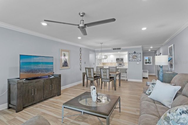 17920 Gulf Blvd Unit 1901, Redington Shores, FL 33708 - living room with ornamental molding, a ceiling fan, baseboards, recessed lighting, and light wood-style flooring