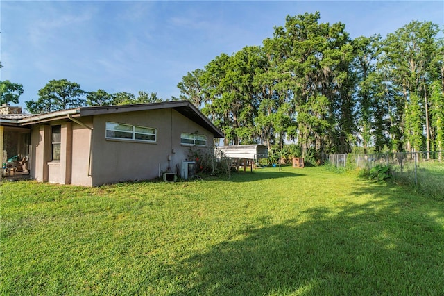 10818 Land O Lakes Blvd, Land O Lakes, FL 34638 - view of yard with central air condition unit and a detached carport