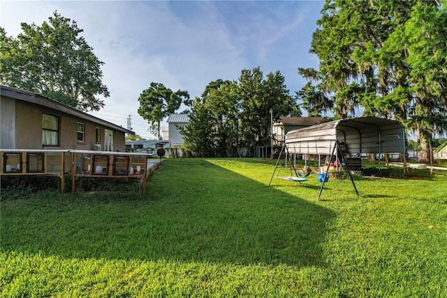 10818 Land O Lakes Blvd, Land O Lakes, FL 34638 - view of grassy yard with a carport and a playground