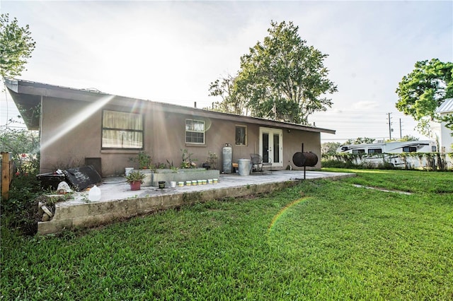 10818 Land O Lakes Blvd, Land O Lakes, FL 34638 - back of property with french doors, a patio area, and stucco siding