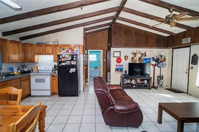 10818 Land O Lakes Blvd, Land O Lakes, FL 34638 - kitchen with freestanding refrigerator, white range with electric cooktop, a ceiling fan, light tile patterned floors, and brown cabinets
