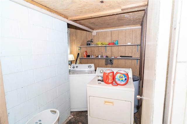 10818 Land O Lakes Blvd, Land O Lakes, FL 34638 - laundry room featuring washer and dryer and wooden walls