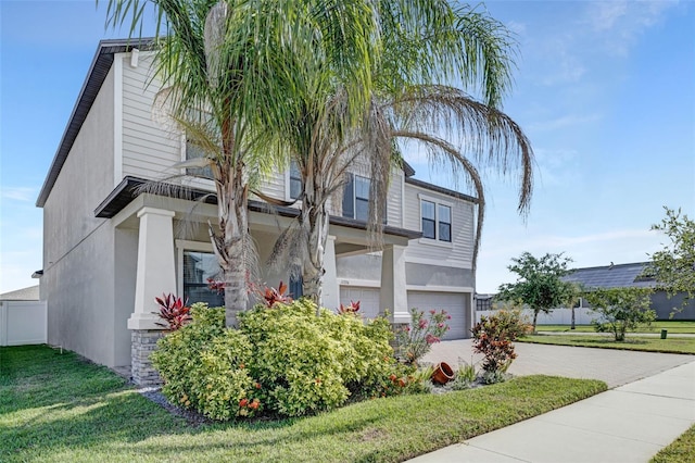 11726 Sunburst Marble Rd, Riverview, FL 33579 - view of property exterior with stucco siding, an attached garage, decorative driveway, and a yard