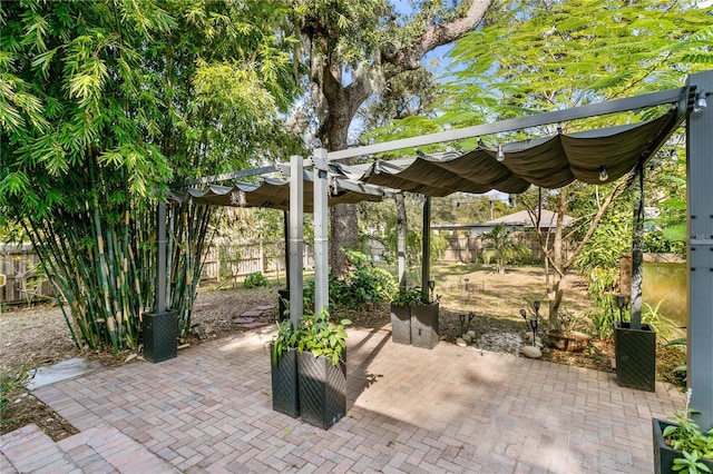 1402 E Mohawk Ave, Tampa, FL 33604 - fenced backyard featuring a pergola and a patio