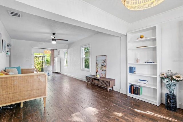 1402 E Mohawk Ave, Tampa, FL 33604 - living room with wood-type flooring, a ceiling fan, built in features, and baseboards