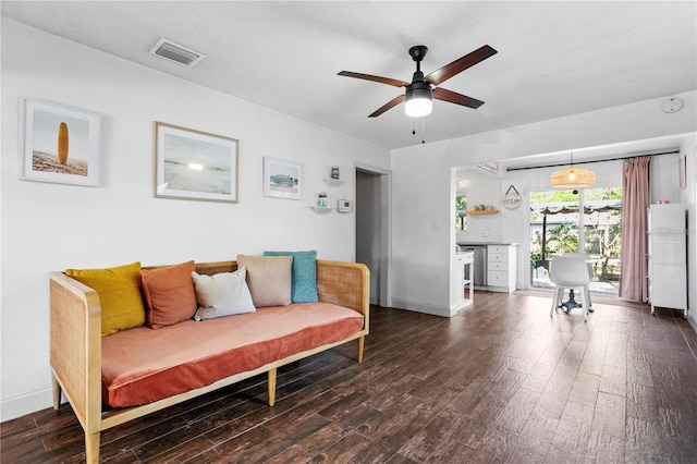 1402 E Mohawk Ave, Tampa, FL 33604 - living room featuring dark wood finished floors, a ceiling fan, and baseboards