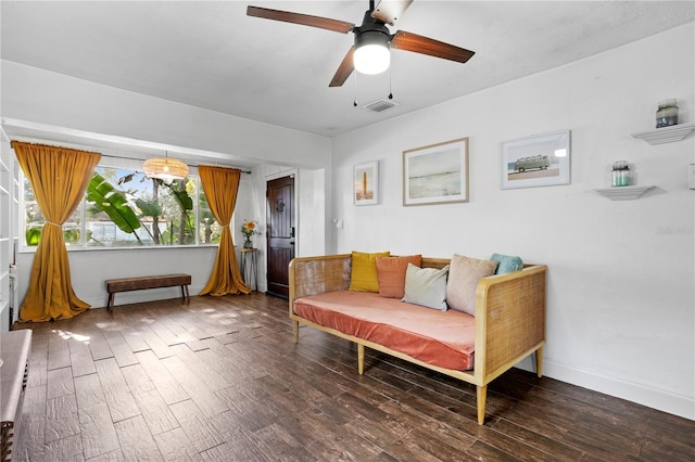 1402 E Mohawk Ave, Tampa, FL 33604 - sitting room featuring wood finished floors, ceiling fan, and baseboards