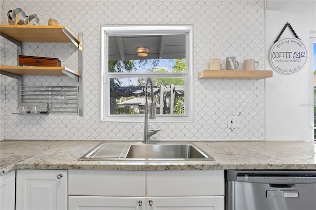 1402 E Mohawk Ave, Tampa, FL 33604 - kitchen featuring open shelves, dishwasher, a sink, and white cabinetry