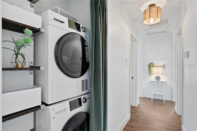 1402 E Mohawk Ave, Tampa, FL 33604 - washroom with estacked washer and dryer, wood finished floors, baseboards, and attic access