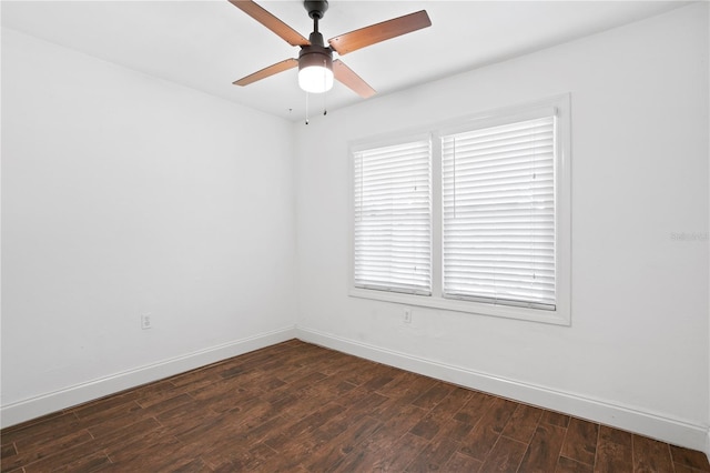 1402 E Mohawk Ave, Tampa, FL 33604 - empty room featuring baseboards, dark wood finished floors, and a ceiling fan