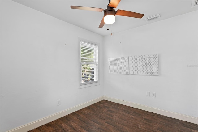 1402 E Mohawk Ave, Tampa, FL 33604 - empty room featuring baseboards, dark wood-style floors, and a ceiling fan