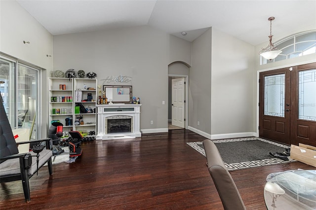 447 Bridle Path Way, Tarpon Springs, FL 34688 - entryway with french doors, wood finished floors, high vaulted ceiling, arched walkways, and baseboards