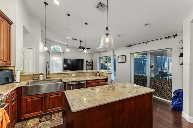 447 Bridle Path Way, Tarpon Springs, FL 34688 - kitchen featuring a sink, dark wood finished floors, light stone countertops, pendant lighting, and a peninsula