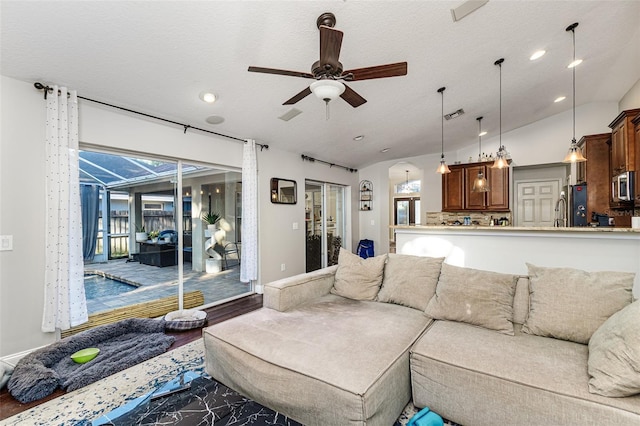 447 Bridle Path Way, Tarpon Springs, FL 34688 - living area featuring a ceiling fan, recessed lighting, lofted ceiling, and dark wood-style floors