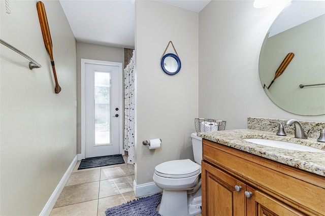 447 Bridle Path Way, Tarpon Springs, FL 34688 - bathroom with vanity, toilet, baseboards, tile patterned flooring, and curtained shower