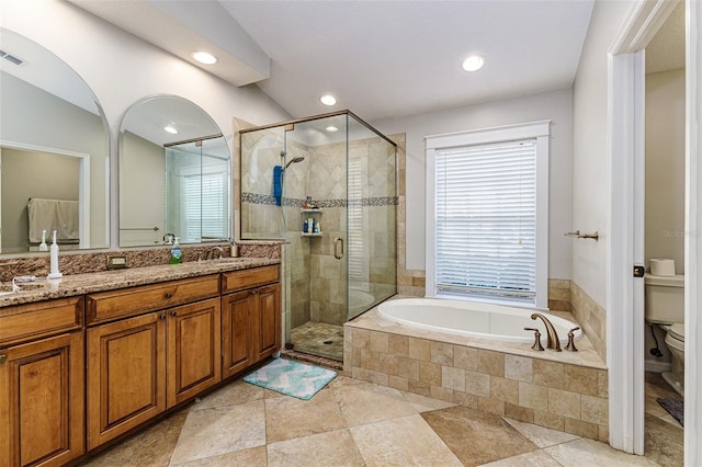 447 Bridle Path Way, Tarpon Springs, FL 34688 - full bathroom featuring toilet, a garden tub, a stall shower, vanity, and recessed lighting