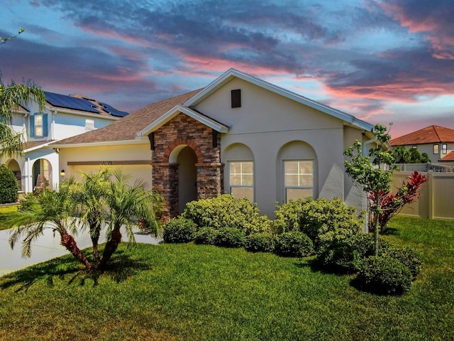 11623 Tetrafin Dr, Riverview, FL 33579 - view of front of property featuring a garage, stucco siding, roof with shingles, and stone siding