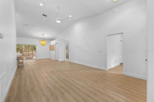 7644 Conrad St, Wesley Chapel, FL 33544 - unfurnished living room featuring a ceiling fan, high vaulted ceiling, light wood-type flooring, and baseboards