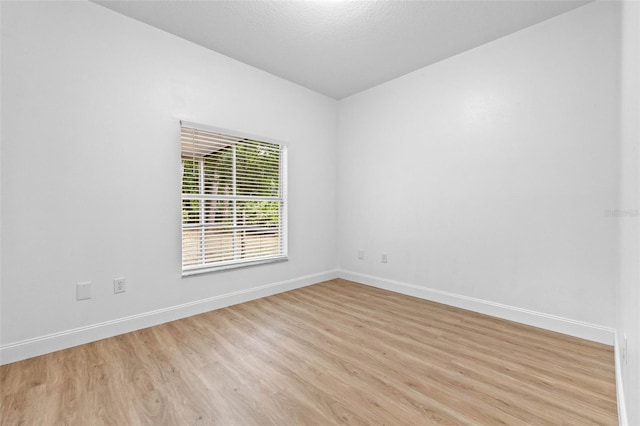 7644 Conrad St, Wesley Chapel, FL 33544 - unfurnished room with light wood-style flooring and baseboards