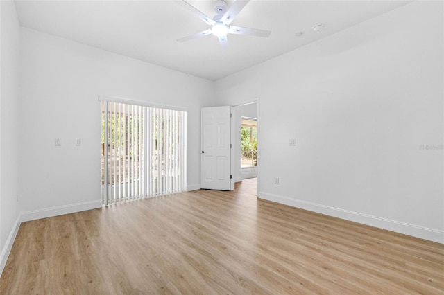 7644 Conrad St, Wesley Chapel, FL 33544 - spare room featuring light wood-style flooring, a ceiling fan, baseboards, and a smoke detector