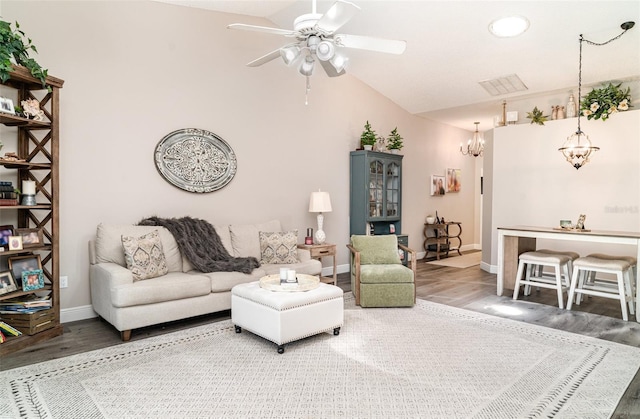 2403 Nantucket Field Way Unit 27, Sun City Center, FL 33573 - living room with a chandelier, wood finished floors, vaulted ceiling, a ceiling fan, and baseboards