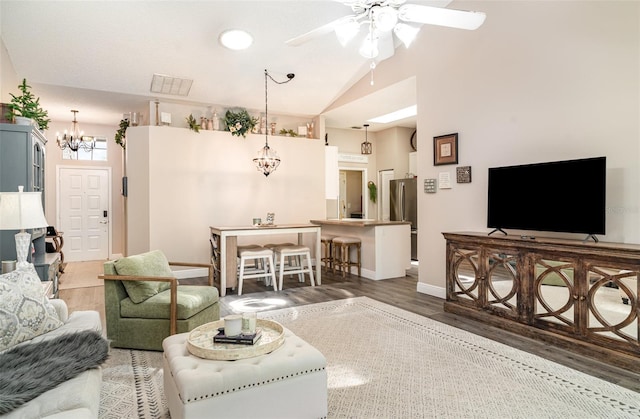 2403 Nantucket Field Way Unit 27, Sun City Center, FL 33573 - living room with a chandelier, wood finished floors, a ceiling fan, vaulted ceiling, and baseboards