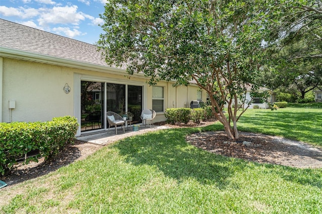 2403 Nantucket Field Way Unit 27, Sun City Center, FL 33573 - view of green lawn with a patio area
