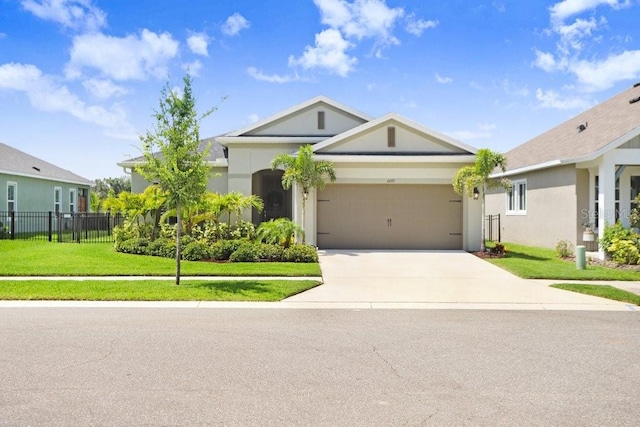 6097 Golden Nettle Dr, Apollo Beach, FL 33572 - single story home featuring concrete driveway, an attached garage, and stucco siding