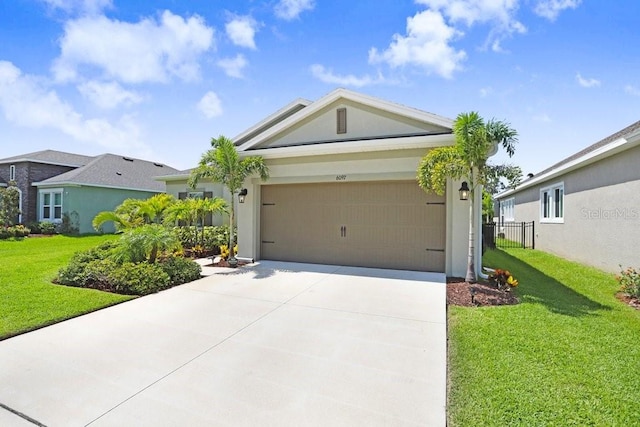 6097 Golden Nettle Dr, Apollo Beach, FL 33572 - view of front of house with concrete driveway, an attached garage, and stucco siding