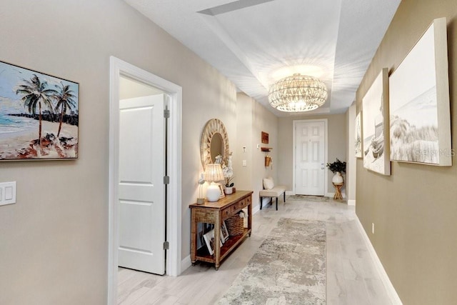6097 Golden Nettle Dr, Apollo Beach, FL 33572 - corridor featuring a chandelier and baseboards