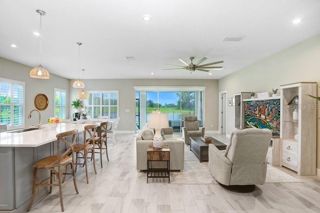 6097 Golden Nettle Dr, Apollo Beach, FL 33572 - living area featuring healthy amount of natural light, ceiling fan, recessed lighting, and baseboards