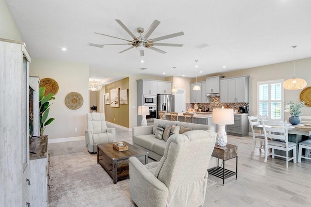 6097 Golden Nettle Dr, Apollo Beach, FL 33572 - living area with ceiling fan, a chandelier, light wood-style floors, recessed lighting, and baseboards