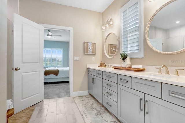 6097 Golden Nettle Dr, Apollo Beach, FL 33572 - bathroom featuring double vanity, a ceiling fan, ensuite bathroom, and baseboards