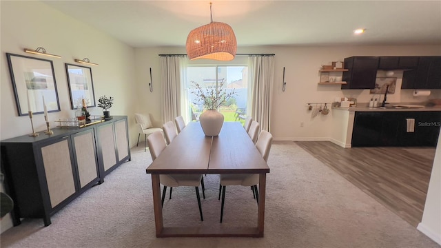 10123 Carp Hollow Rd, Sun City Center, FL 33573 - dining space with light colored carpet, baseboards, and recessed lighting